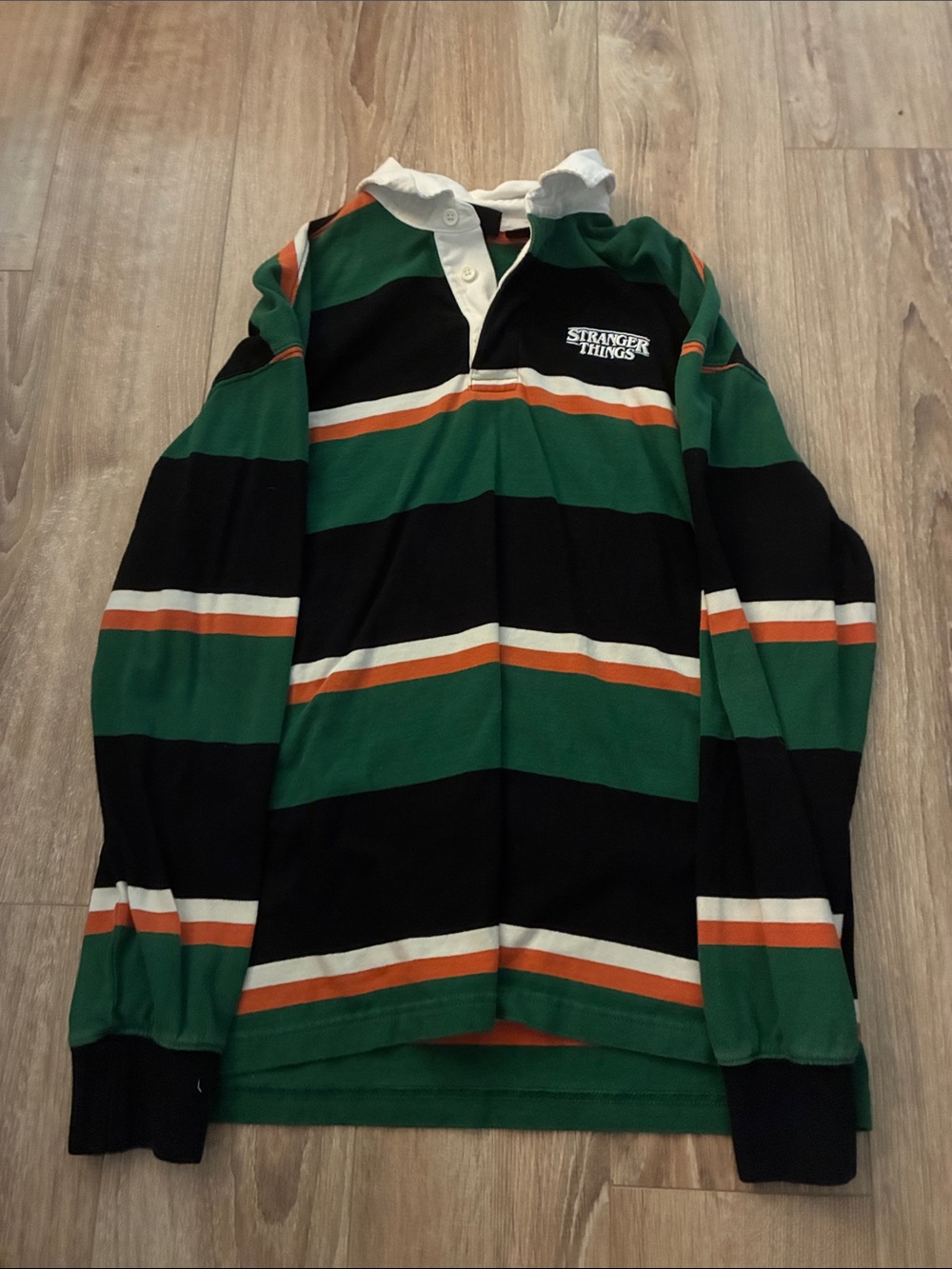 H&M Stranger Things Green, Black & White Rugby Shirt with Orange Stripes